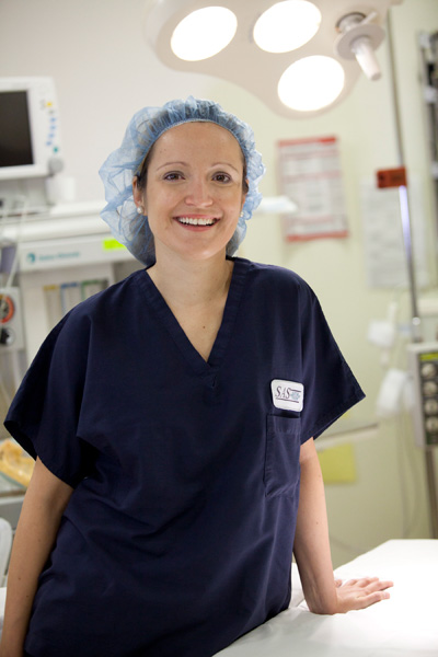 Dr. Cristina Dracea in scrubs and smiling