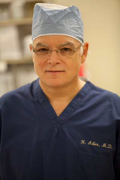 Dr. Hilton C. Adler posing in scrubs